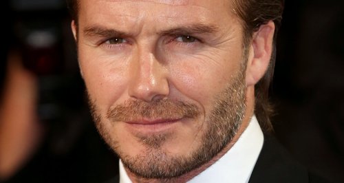 David Beckham wears a red ribbon