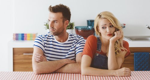 Arguing couple at the table